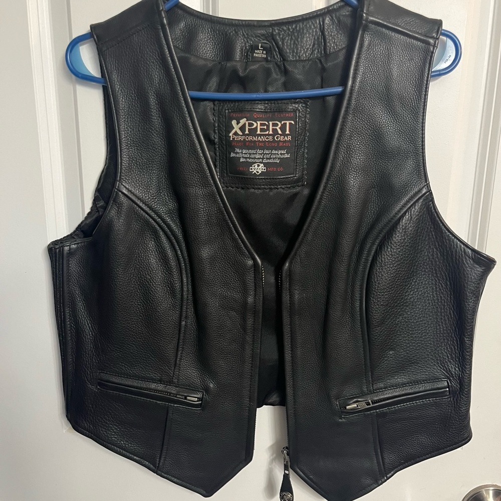 Women’s size large leather riding vest.